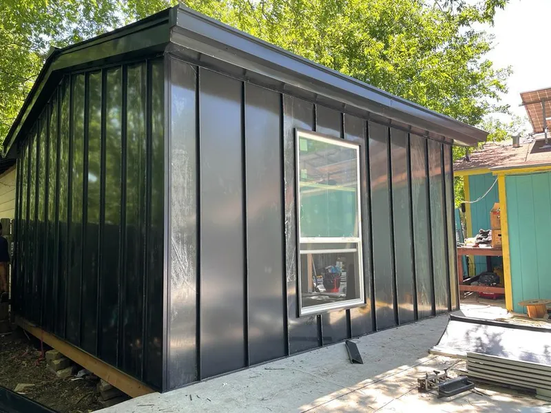 Black standing seam metal wall panels for Roof Inspection in Schriever